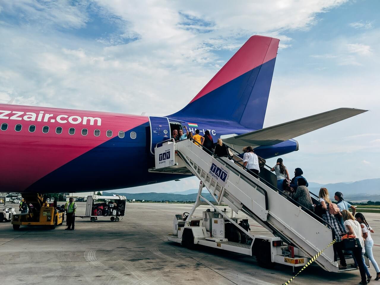 Passengers boarding a Wizz Air aircraft 