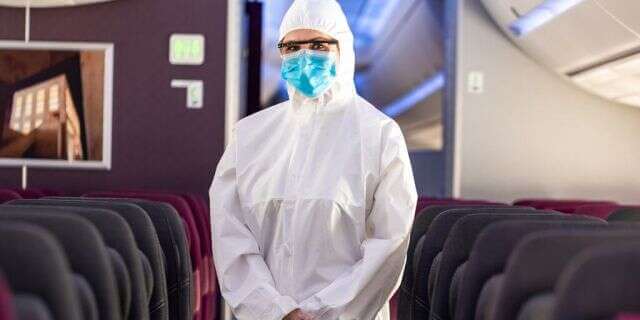 Qatar Airways Flight Attendant in PPE