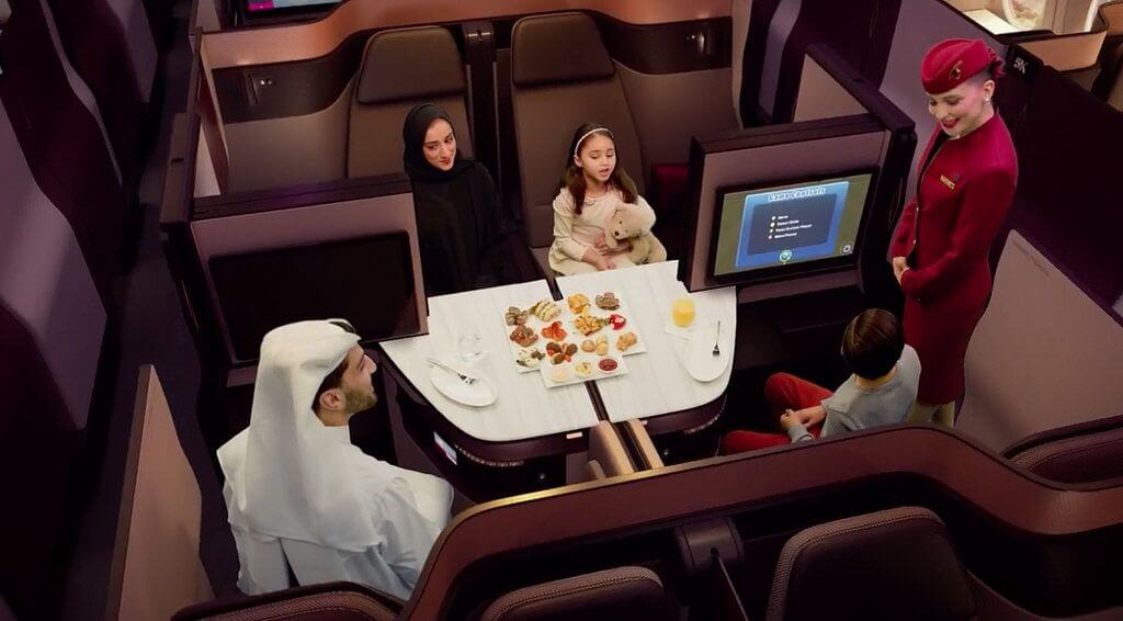 Family in Qatar Airways Qsuite 