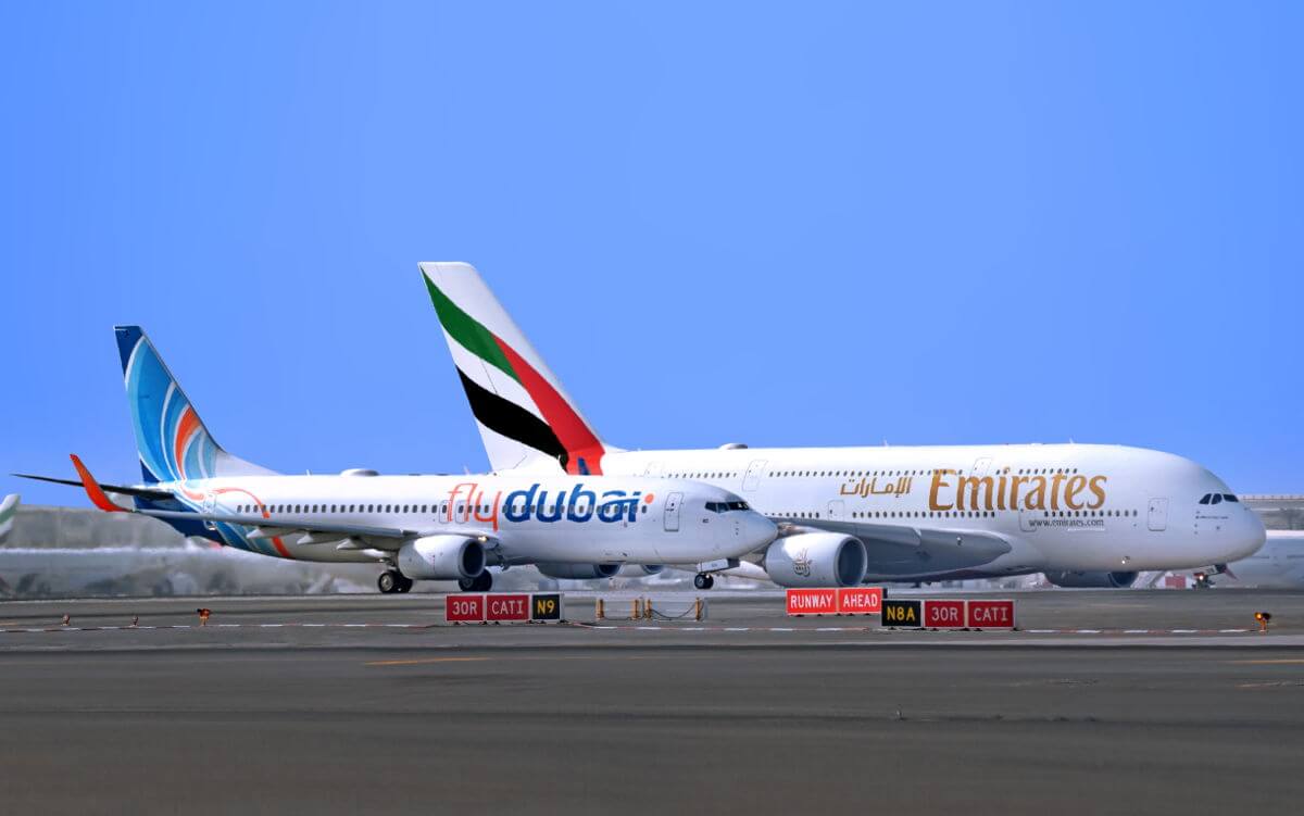 Emirates A380 and flydubai 737 parked on the tarmac